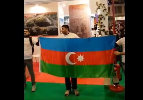 Азербайджанцы заслонили флагами армянский стенд на туристической выставке в Мадриде 
